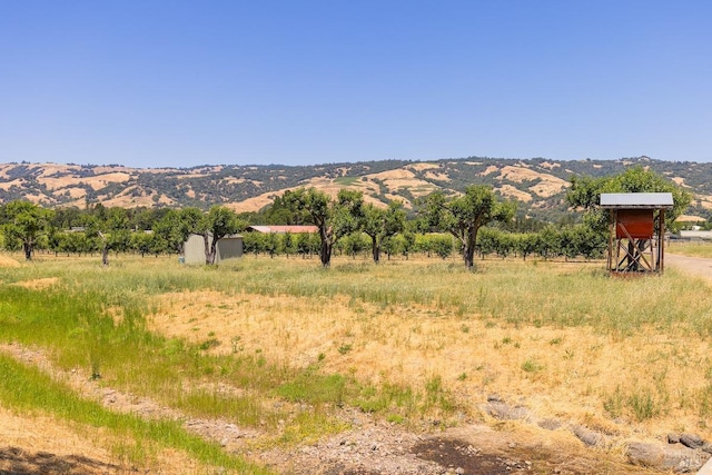 property view of mountains featuring a rural view