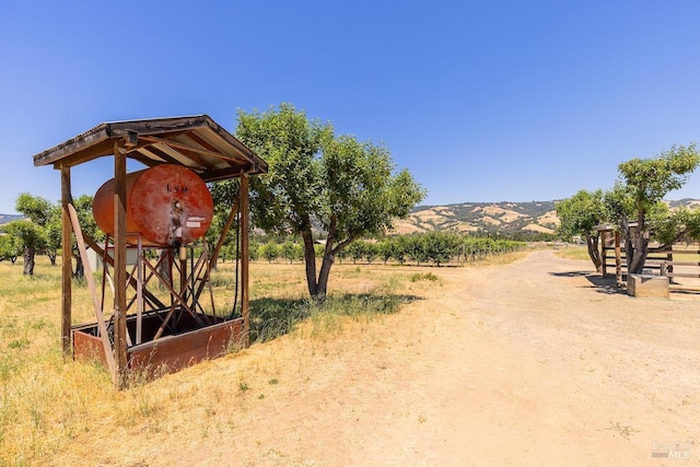 exterior space with a mountain view and a rural view