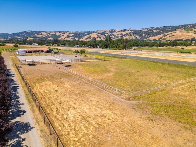 drone / aerial view featuring a mountain view and a rural view