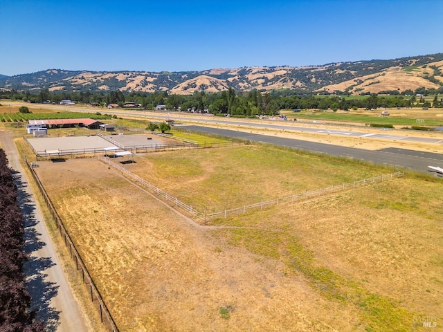 drone / aerial view with a mountain view and a rural view