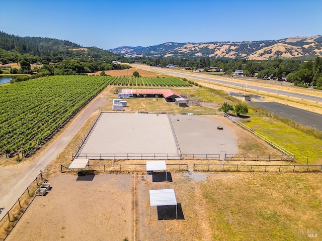 drone / aerial view featuring a mountain view and a rural view