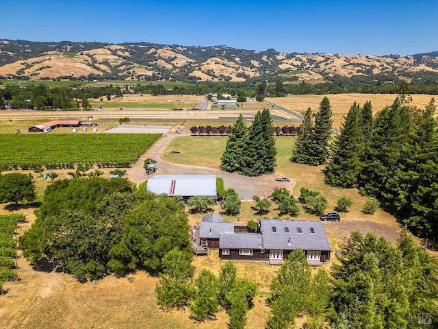 drone / aerial view with a mountain view and a rural view