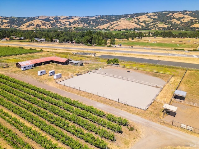 birds eye view of property featuring a mountain view and a rural view