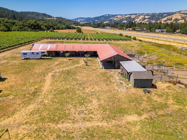 drone / aerial view with a mountain view and a rural view