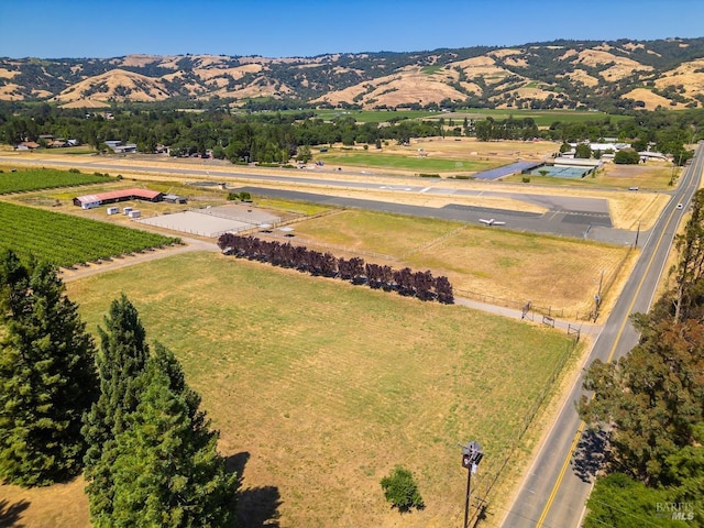 drone / aerial view featuring a mountain view and a rural view