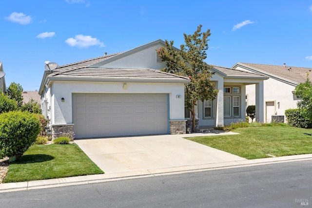 view of front of home featuring a front lawn, a garage, and central AC