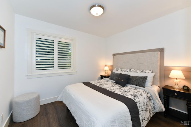 bedroom featuring dark hardwood / wood-style flooring