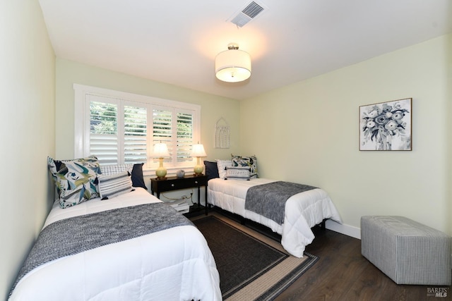 bedroom featuring dark wood-type flooring