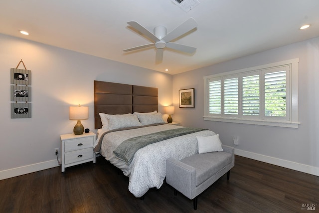 bedroom with dark hardwood / wood-style floors and ceiling fan
