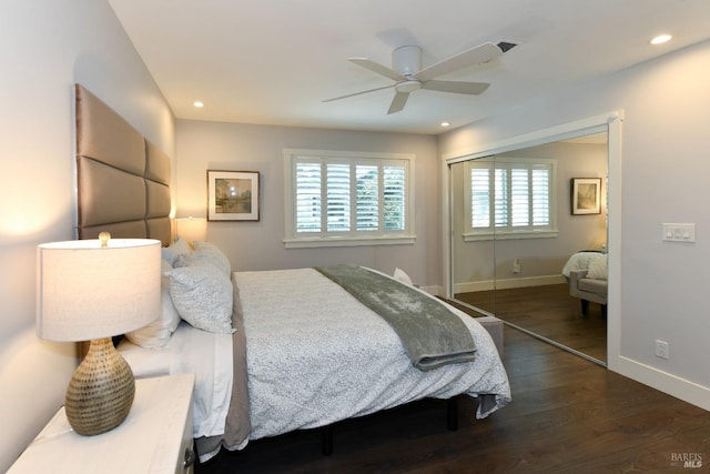 bedroom featuring dark hardwood / wood-style flooring, a closet, and ceiling fan