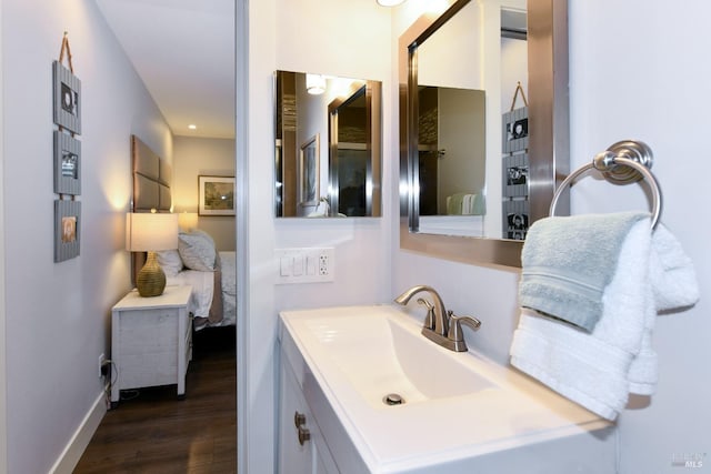 bathroom featuring vanity and hardwood / wood-style flooring