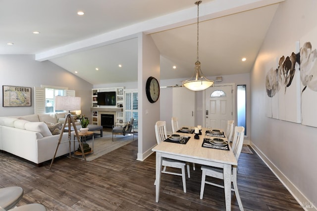 dining space featuring vaulted ceiling with beams and dark wood-type flooring