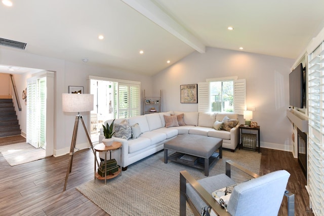 living room with vaulted ceiling with beams and wood-type flooring