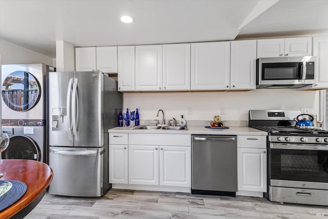 kitchen featuring white cabinetry, appliances with stainless steel finishes, and sink