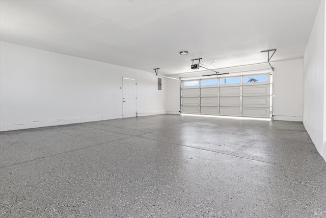 garage featuring a garage door opener and electric panel