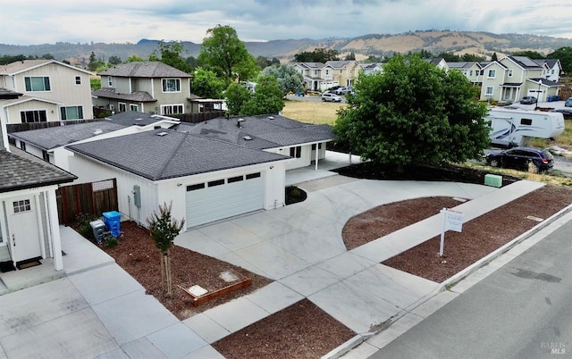 birds eye view of property with a mountain view