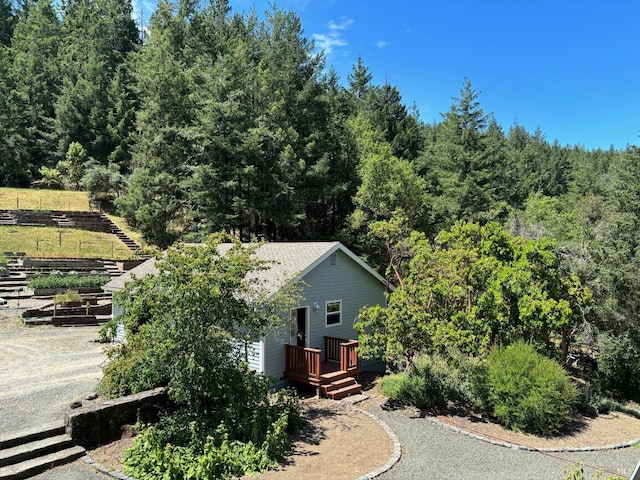 view of property exterior with a deck