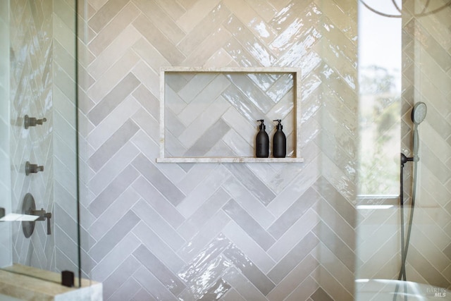 bathroom with walk in shower and vanity