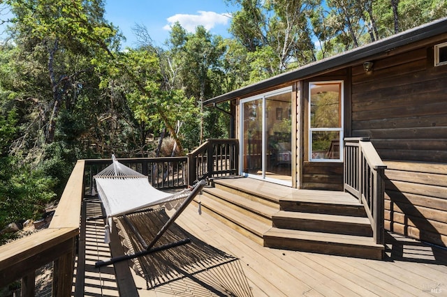 wooden terrace with a sunroom