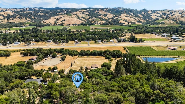 bird's eye view featuring a rural view and a water and mountain view