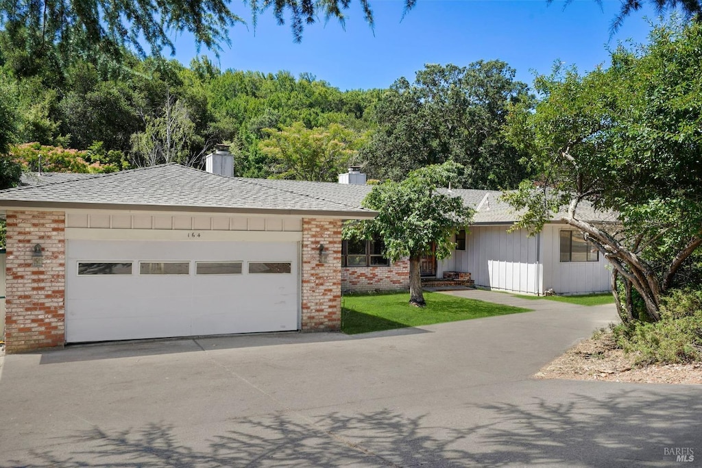 single story home featuring a garage