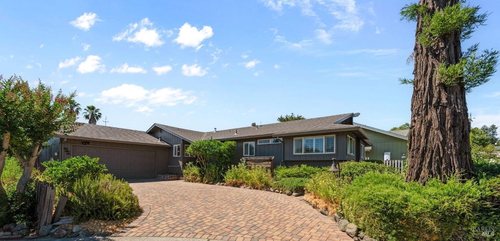 single story home with a garage