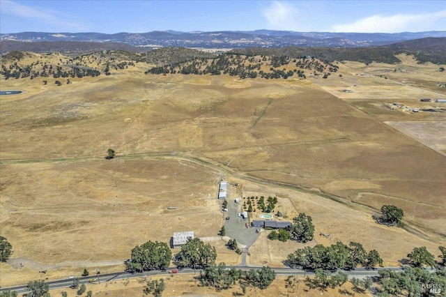 aerial view with a mountain view and a rural view