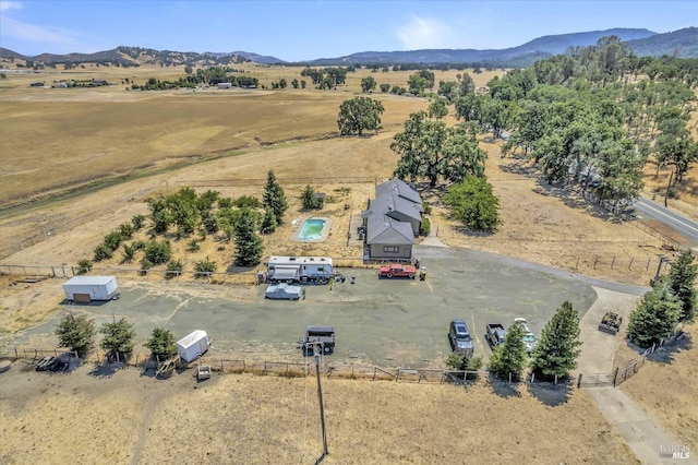 birds eye view of property featuring a mountain view and a rural view