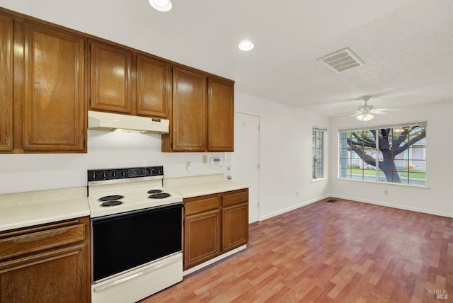 kitchen with electric range, light hardwood / wood-style flooring, and ceiling fan