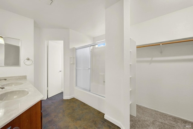 bathroom featuring vanity and an enclosed shower