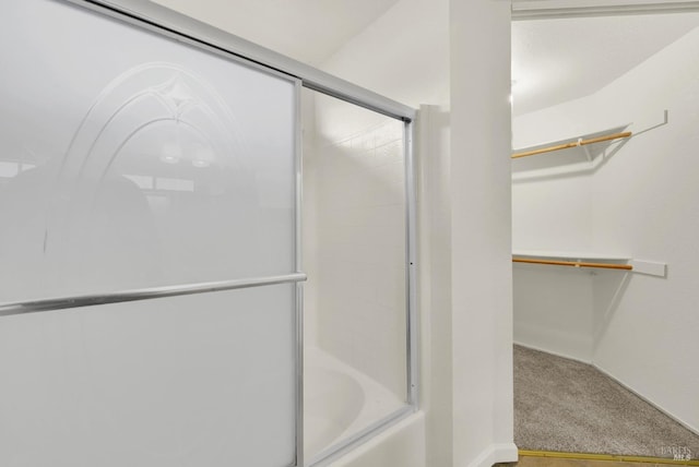 bathroom featuring enclosed tub / shower combo