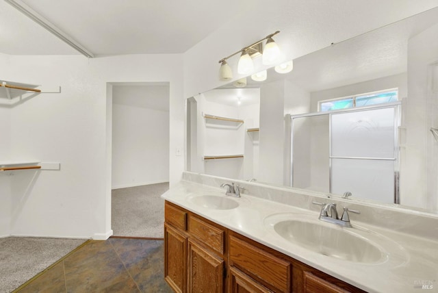 bathroom with vanity and an enclosed shower