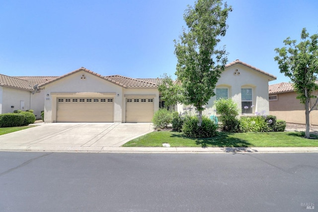 mediterranean / spanish-style home featuring a garage