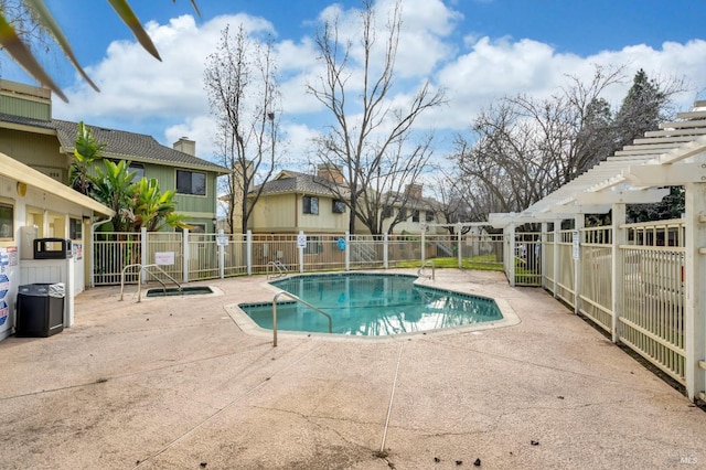 view of swimming pool with a pergola and a patio