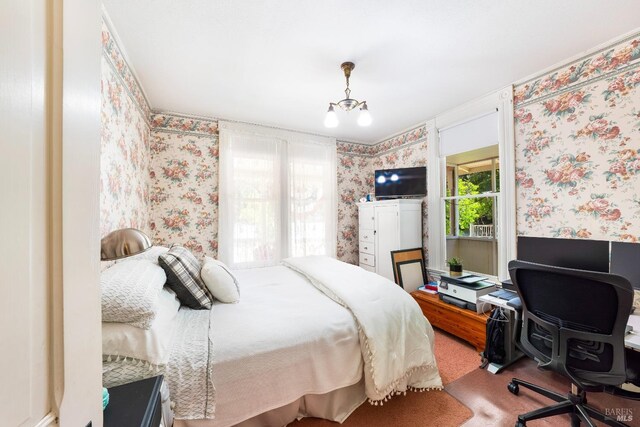 bedroom featuring multiple windows and carpet flooring