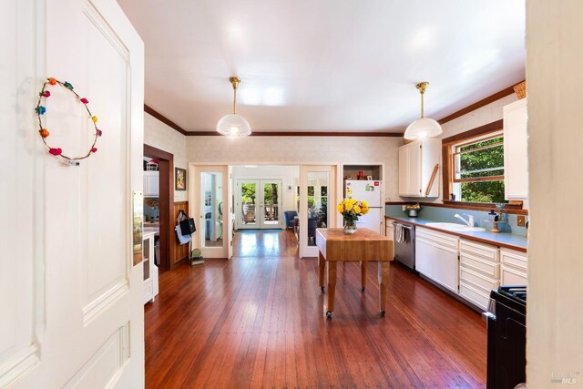 kitchen featuring french doors, sink, decorative light fixtures, dishwasher, and white fridge