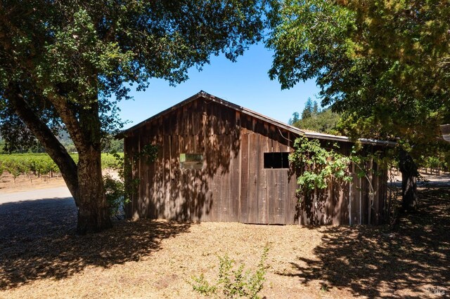 view of side of property with an outbuilding