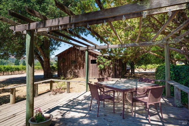 view of patio / terrace with a wooden deck and a pergola