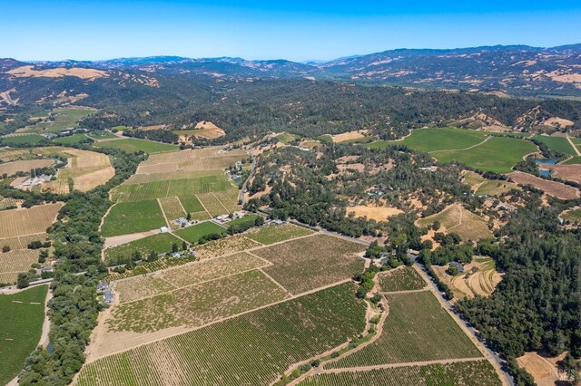 aerial view featuring a mountain view and a rural view