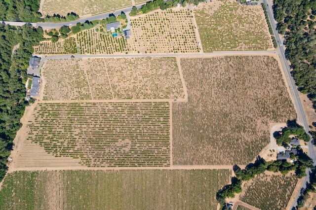 birds eye view of property with a rural view