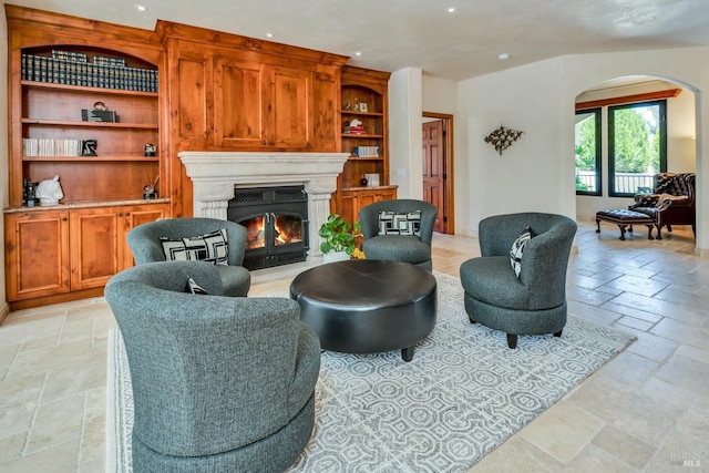 living room featuring built in shelves