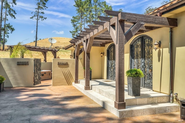 view of patio with a pergola and french doors