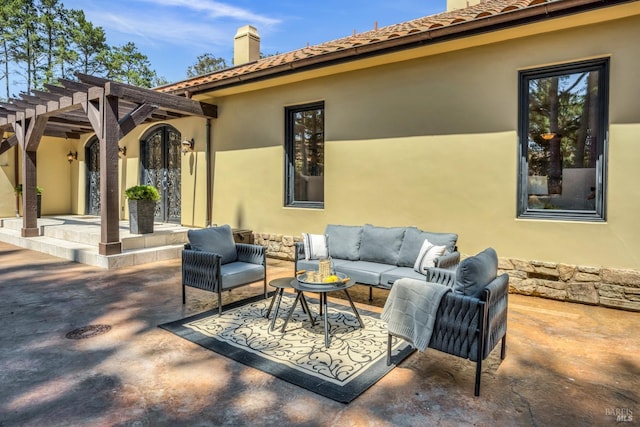 view of patio / terrace with an outdoor living space and a pergola