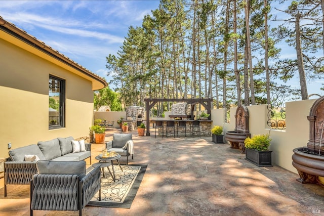 view of patio / terrace with exterior bar and outdoor lounge area