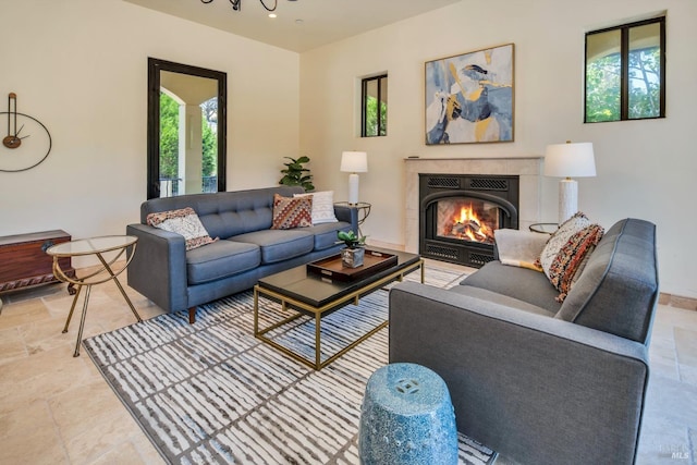 living room featuring a tile fireplace