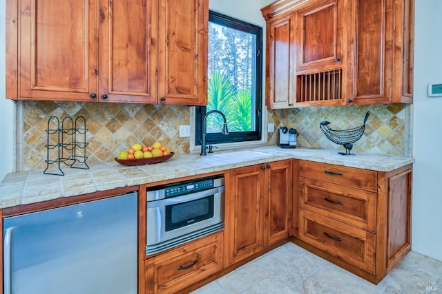 kitchen featuring sink and decorative backsplash