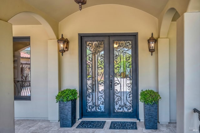 property entrance featuring french doors