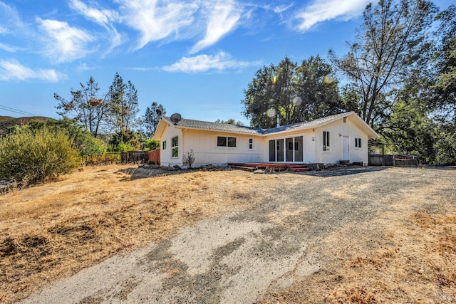 view of front of home featuring fence