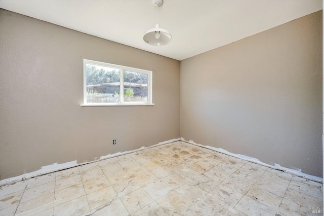 unfurnished room featuring light floors