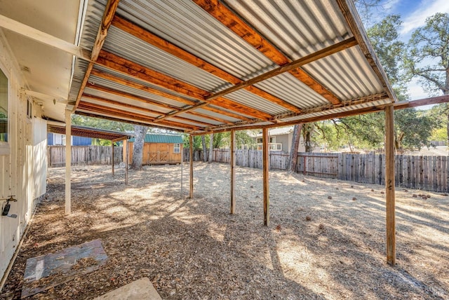 view of patio / terrace featuring a fenced backyard and an outdoor structure